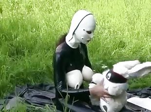 Rubber Girl Full in Black Latex Catsuit and Mask Plays with herself Outdoor in a Meadow - Part 3