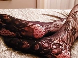 Wife laying on the bed, showing her legs, feet and ass in pantyhose