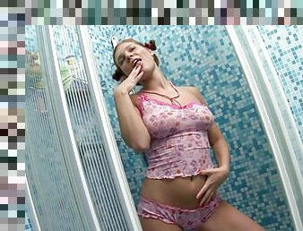 Solo teen girl is showing her big tits in bathroom