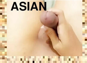 Asian guy alone with uncut cock