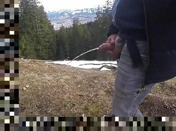 While hiking in the mountains I had to piss, then I jerked my cock with pleasure
