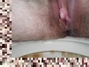 Trans guy pissing in the toilet