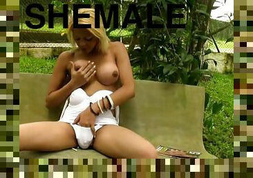 Tempting shemale blonde undresses and masturbates in public