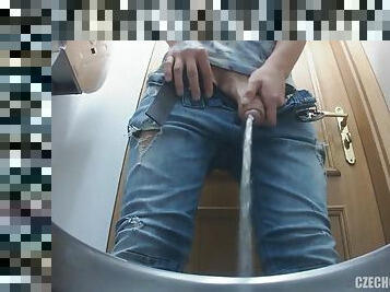 Guys secretly filmed in a public restroom
