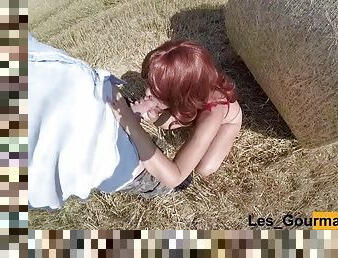 Horny redhead MILF sucks in a field with a butt plug. Huge facial cumshot