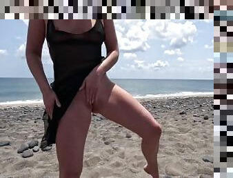girl flashes her pussy and jerks off in public on the beach