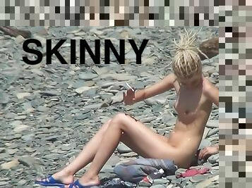 Sexy blonde shows off her naked skinny shape