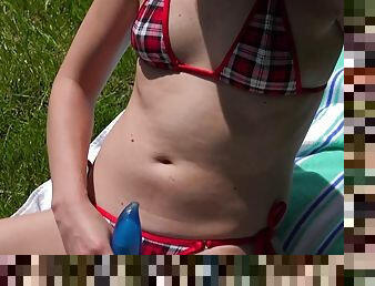 Blonde teen with small tits toys herself outdoors
