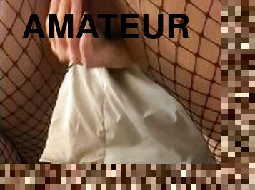 Dildo in crotchless fishnets