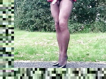 Black pantyhose schoolgirl outdoors in public .