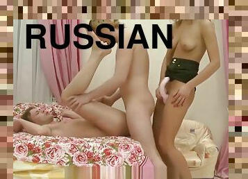 Russian video. Girl dominates two guys.
