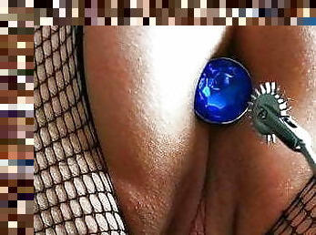 Blue butt plug, fishnet, pinwheel