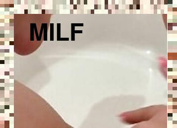 Hot milf alone in her bathroom rubbing her shaved pussy