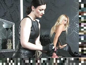 Two european dominas giving leather sub the cbt treatment