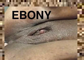Ebony bitch loves fingering her ass