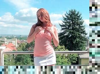 Perky redhead minx showing off her curves outdoor