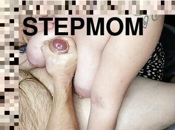 Stepmom lets me use her big tits to cum.