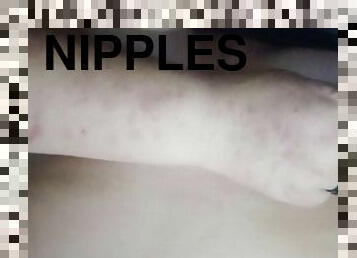 Pinching erect nipples