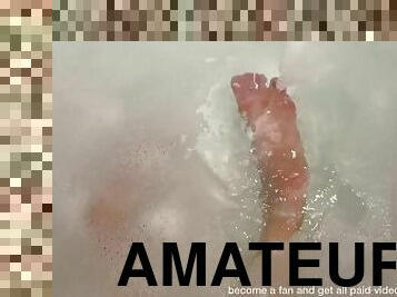 Wet shiny soles in a bubble bath flirt with you