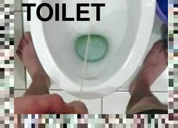 Pissing in toilet