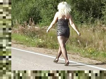 Milf in a mini dress on the road