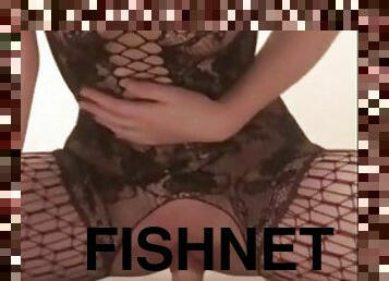 Hot girl in fishnet stockings rides a dildo on the floor