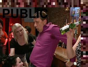 Dark Hair Girl takes two dicks in public bar