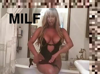 MILF with big boobs masturbates with her dildo