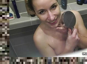 Hairy dark haired lady washes her vagina in the shower