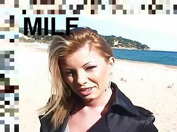 Blonde MILF walking on the beach before sex