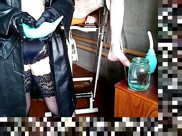 Mistress washing slaves ass with two different enemas