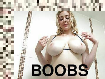Blondie with huge tits takes a sensual shower