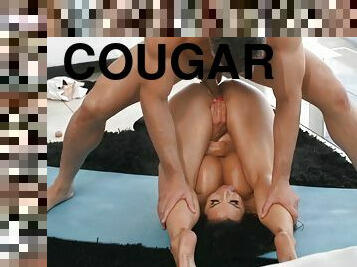 Dark-haired cougar with huge melons pleasures Charles in the living room