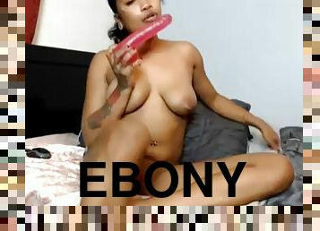 Hot ebony sucks and fucks her hot dildo