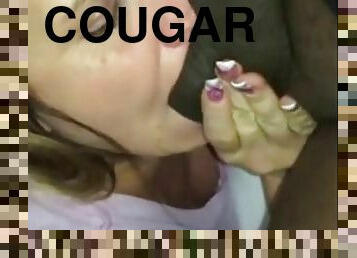 White cougar eats black cock