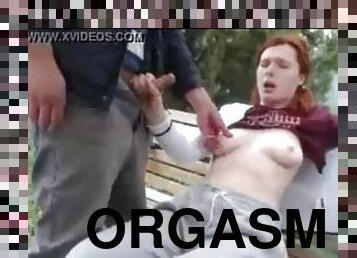 Redheads super remote controlled orgasm in the park while boyfriend watches
