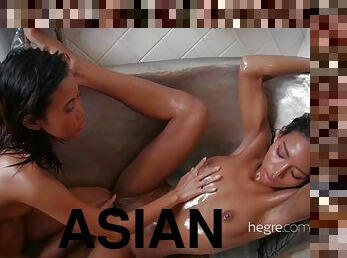 Two asians girls take a bath together