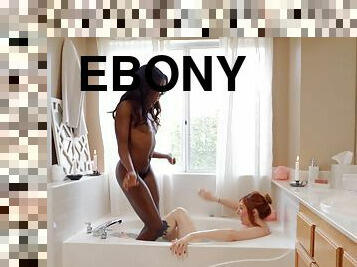 Ebony doll shares passion for white pussy in the soapy bath