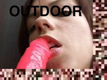 Young doll masturbating in outdoor