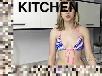 Fuckable blonde babe shows off her pussy in the kitchen