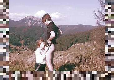 Spectacular standing sex in a mountainous setting for sultry redhead