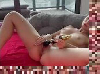 She took off all her clothes, lay down on the floor and has fun with her favorite vibrator.