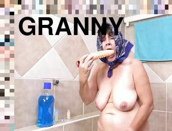 73 years old granny peeing at the bathtub