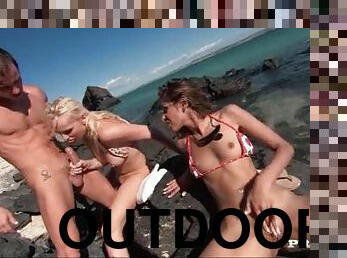 Luscious ladies in bikinis getting their holes slammed on a beach