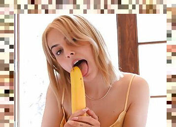 Dazzling teen plays with her big banana in a sensual solo play