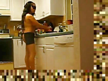 Nearly nude wife cooks in kitchen