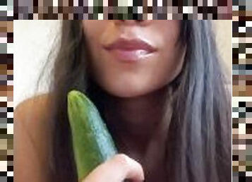 Sucking a cucumber