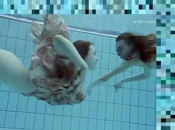 Slim euro girls lada and anna swim naked in a pool