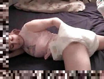 Young cutie masturbates in a diaper