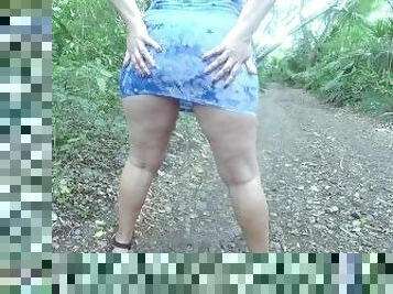 Walking and pissing in short dress outdoors